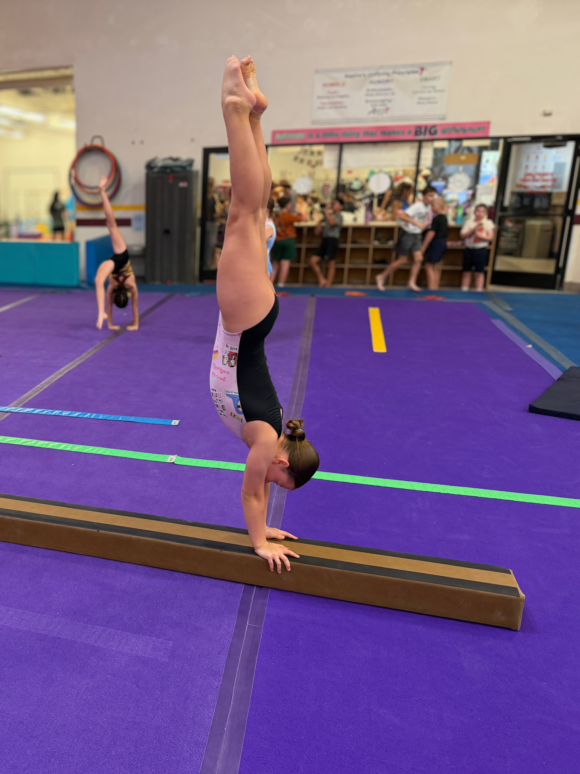 Girl on 8" wide full size balance beam